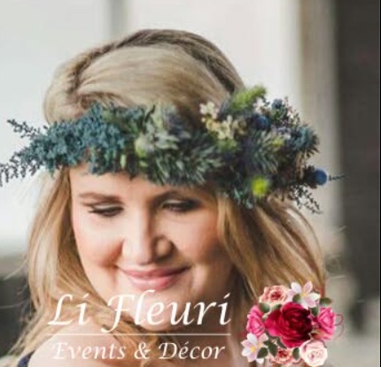 Woman wearing a fresh flower crown of blue thistles, greenery and pink blooms